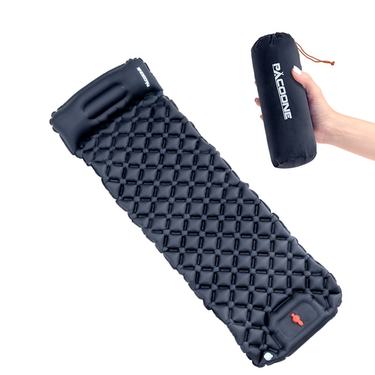 Inflatable sleeping pad with integrated pump